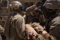 U.S. Marines with Company B, 1st Battalion, 3rd Marine Regiment, conduct a simulated casualty evacuation as a part of a Battalion Assault Course during an Integrated Training Exercise (ITX) aboard Marine Corps Air Ground Combat Center Twentynine Palms, Calif., Aug. 12, 2015. ITX is conducted to enhance the integration and warfighting capability from all elements of the Marine Air Ground Task Force. (U.S. Marine Corps photo by Lance Cpl. Clarence A. Leake/Released)