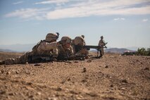 U.S. Marines with Company B, 1st Battalion, 3rd Marine Regiment, conduct a simulated casualty evacuation as a part of a Battalion Assault Course during an Integrated Training Exercise (ITX) at Marine Corps Air Ground Combat Center Twentynine Palms, Calif., Aug. 12, 2015. ITX is conducted to enhance the integration and warfighting capability from all elements of the Marine Air Ground Task Force. (U.S. Marine Corps photo by Lance Cpl. Clarence A. Leake/Released)