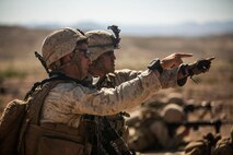U.S. Marine Corps Sgt. Adam Ferretti, squad leader, and Cpl. Jacob Gomez, team leader with Company B, 1st Battalion, 3rd Marine Regiment, discuss the plan of attack as part of a Battalion Assault Course during an Integrated Training Exercise (ITX) at Marine Corps Air Ground Combat Center Twentynine Palms, Calif., Aug. 11, 2015. ITX is conducted to enhance the integration and warfighting capability from all elements of the Marine Air Ground Task Force. (U.S. Marine Corps photo by Lance Cpl. Clarence A. Leake/Released)