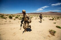 U.S. Marines with Company B, 1st Battalion, 3rd Marine Regiment, maneuver toward simulated enemy positions as part of a Battalion Assault Course during an Integrated Training Exercise (ITX) at Marine Corps Air Ground Combat Center Twentynine Palms, Calif., Aug. 11, 2015. ITX is conducted to enhance the integration and warfighting capability from all elements of the Marine Air Ground Task Force. (U.S. Marine Corps photo by Lance Cpl. Clarence A. Leake/Released)