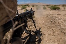 U.S. Marine Corps Pfc. John Constant with Company B, 1st Battalion, 3rd Marine Regiment, fires a M27 infantry assault rifle as part of a Battalion Assault Course during an Integrated Training Exercise (ITX) at Marine Corps Air Ground Combat Center Twentynine Palms, Calif., Aug. 11, 2015. ITX is conducted to enhance the integration and warfighting capability from all elements of the Marine Air Ground Task Force. (U.S. Marine Corps photo by Lance Cpl. Clarence A. Leake/Released)