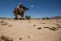 U.S. Marine Corps Lance Cpl. Joshua Case with Company B, 1st Battalion, 3rd Marine Regiment, fires a M27 infantry assault rifle as part of a Battalion Assault Course during an Integrated Training Exercise (ITX) at Marine Corps Air Ground Combat Center Twentynine Palms, Calif., Aug. 11, 2015. ITX is conducted to enhance the integration and warfighting capability from all elements of the Marine Air Ground Task Force. (U.S. Marine Corps photo by Lance Cpl. Clarence A. Leake/Released)