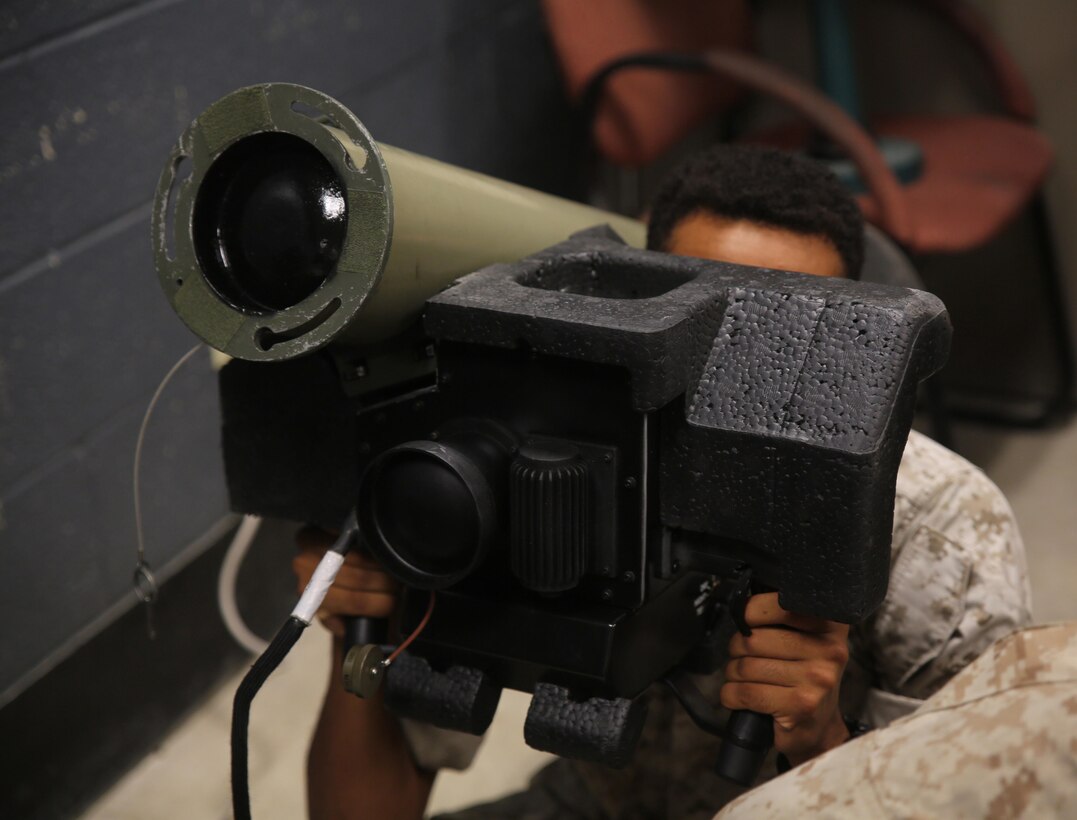 Lance Cpl. Morgan Canady-Town, a machine gunner with Combined Anti-Armor Team Platoon, Weapons Company, 2nd Battalion, 2nd Marine Regiment, operates a simulated FGM-148 Javelin during a simulated anti-armor exercise at Camp Lejeune, N.C., August 8, 2015. For machine gunners, the exercise served as cross-training to familiarize non-missile men with missile systems. (U.S. Marine Corps photo by Cpl. Paul S. Martinez/Released)