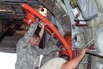 Airmen assigned to the 153rd Airlift Wing load and configure a Modular Airborne Fire Fighting System (MAFFS II) on a C-130H Hercules aircraft. Wyoming Air National Guard MAFFS II certified crews will join aircrews from the 302nd Airlift Wing and the 145th Airlift Wing, North Carolina Air National Guard in California to assist in the containment of fires on the West Coast. 