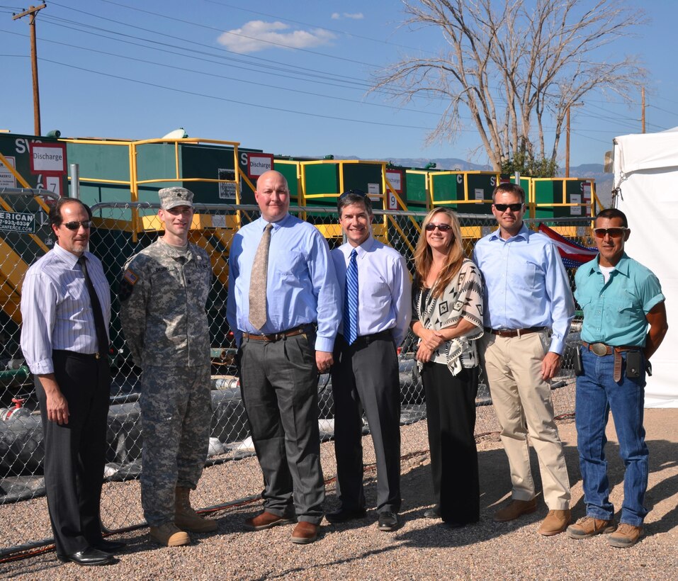 KIRTLAND AIR FORCE BASE, N.M. – The District attended a Milestone Event for the Bulk Fuels Project Aug. 13, 2015. The event marked the beginning of an extraction well that pumps 100 gallons per minute to a treatment center where the contaminants are removed. One million gallons of water have been treated so far.  (l-r): John D’Antonio, Lt. Col. Patrick Dagon, Trent Simpler, Mike Goodrich, Monique Ostermann, Mark Phaneuf and Gene Jaramillo are among the many District team members who’ve been involved in this project over the years.