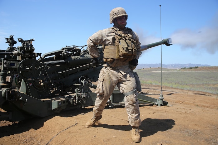 Corporal Alredo Mireles, a field artillery cannoneer with Battery B, 2nd Battalion, 11th Marine Regiment, 1st Marine Division, fires an M777 Howitzer during Summer Fire Exercise 15, aboard Marine Corps Base Camp Pendleton, Calif., Aug. 13, 2015. The exercise, which spans Aug. 6-17, provides an opportunity for Marines to practice standing operating procedures for coordinating and executing fire missions in preparation for future operations. (U.S. Marine Corps photo by Cpl. Demetrius Morgan/RELEASED)