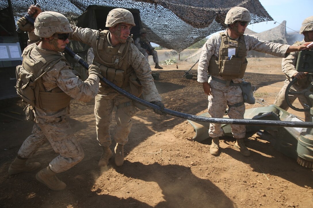 Marines with Battery B, 2nd Battalion, 11th Marine Regiment, 1st Marine Division load an M777 Howitzer during Summer Fire Exercise 15, aboard Marine Corps Base Camp Pendleton, Calif., Aug. 13, 2015. The exercise, which spans Aug. 6-17, provides an opportunity for Marines to practice standing operating procedures for coordinating and executing fire missions in preparation for future operations. (U.S. Marine Corps photo by Cpl. Demetrius Morgan/RELEASED)