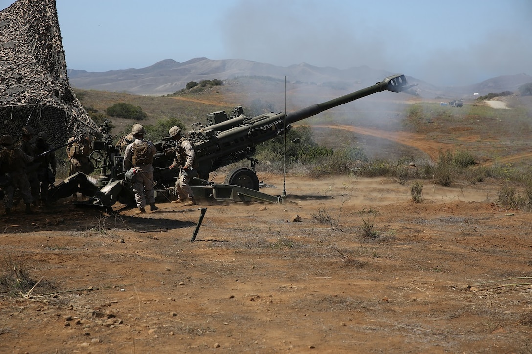 Marines with Battery B, 2nd Battalion, 11th Marine Regiment, 1st Marine Division fire an M777 Howitzer during Summer Fire Exercise 15, aboard Marine Corps Base Camp Pendleton, Calif., Aug. 13, 2015. The exercise, which spans Aug. 6-17, provides an opportunity for Marines to practice standing operating procedures for coordinating and executing fire missions in preparation for future operations.(U.S. Marine Corps photo by Cpl. Demetrius Morgan/RELEASED)