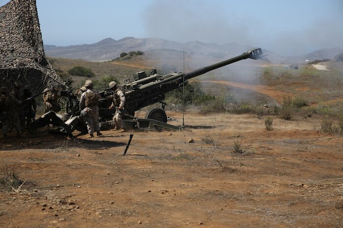 Marines with Battery B, 2nd Battalion, 11th Marine Regiment, 1st Marine Division fire an M777 Howitzer during Summer Fire Exercise 15, aboard Marine Corps Base Camp Pendleton, Calif., Aug. 13, 2015. The exercise, which spans Aug. 6-17, provides an opportunity for Marines to practice standing operating procedures for coordinating and executing fire missions in preparation for future operations.(U.S. Marine Corps photo by Cpl. Demetrius Morgan/RELEASED)