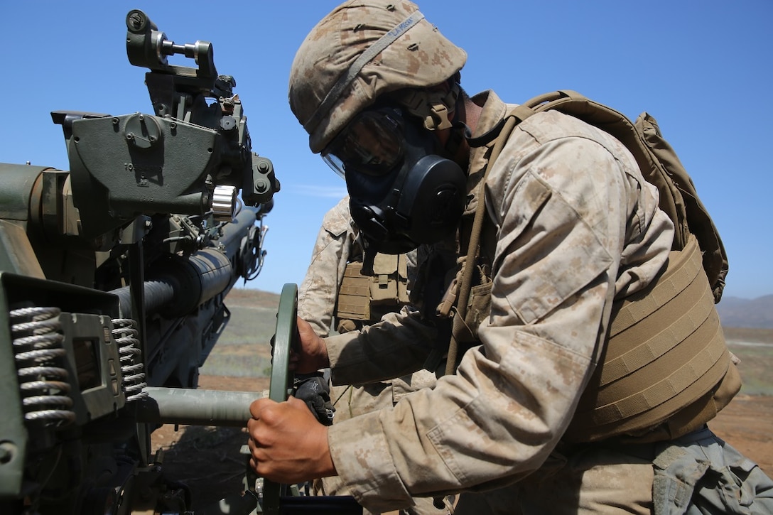 A Marine with Battery B, 2nd Battalion, 11th Marine Regiment, 1st Marine Division adjusts an M777 Howitzer during Summer Fire Exercise 15, aboard Marine Corps Base Camp Pendleton, Calif., Aug. 13, 2015. The exercise, which spans Aug. 6-17, provides an opportunity for Marines to practice standing operating procedures for coordinating and executing fire missions in preparation for future operations. (U.S. Marine Corps photo by Cpl. Demetrius Morgan/RELEASED)