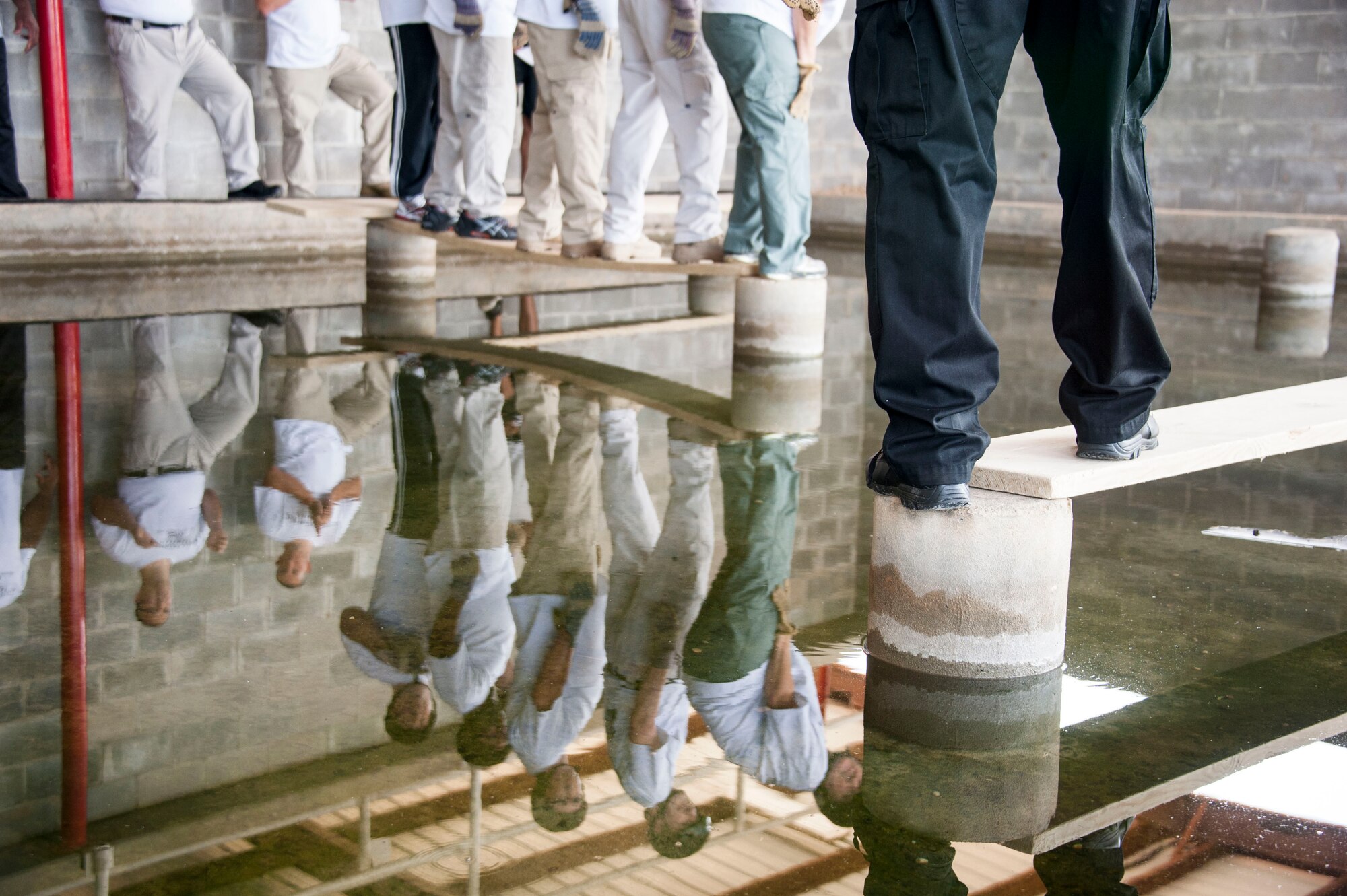 Members of the Montgomery Police Department participate in a Leadership Reaction Course training exercise at Maxwell Air Force Base, Alabama, Aug. 7, 2015, as part of a two-day leadership consortium. The reaction course is designed to help participants apply leadership principles and theory from the classroom in a problem-solving scenario. (U.S. Air Force photo by Tech. Sgt. Sarah Loicano)