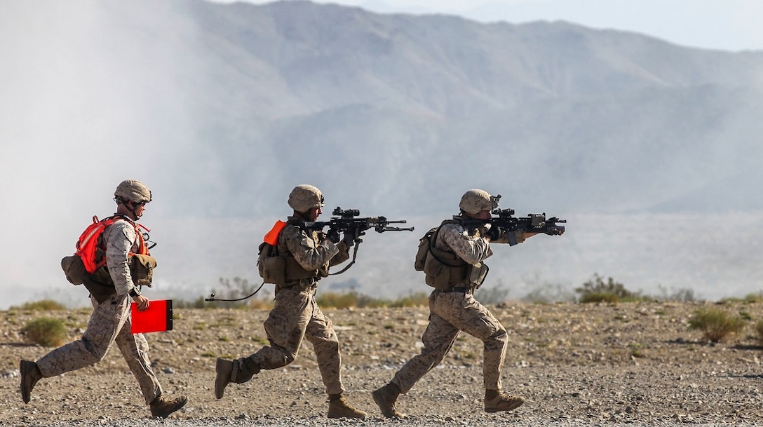Marines with Company A, 1st Battalion, 7th Marine Regiment, rush from building to building during a Military Operation on Urban Terrain exercise aboard Marine Corps Air Ground Combat Center Twentynine Palms, California, Aug. 11, 2015. The MOUT exercise was part of an Integrated Training Exercise that allowed the Marines with Animal Company to showcase their different capabilities in preparation for future deployments.