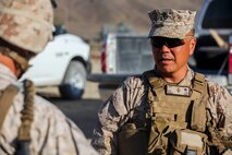 Brigadier Gen. Daniel Yoo, the deputy commanding general of 1st Marine Division, engages with Marines at a military operation on urban terrain exercise held by Company A, 1st Battalion, 7th Marine Regiment, as part of Integrated Training Exercise aboard Marine Corps Air Ground Combat Center Twentynine Palms, California, Aug. 11, 2015. Animal Company showcased the Marine Corps’ ability to execute tactically and proficiently in any area of operation.