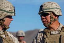 Brigadier Gen. Daniel Yoo, the deputy commanding general of 1st Marine Division, engages with Marines at a military operation on urban terrain exercise held by Company A, 1st Battalion, 7th Marine Regiment, as part of Integrated Training Exercise aboard Marine Corps Air Ground Combat Center Twentynine Palms, California, Aug. 11, 2015. The MOUT exercise was conducted as part of Integrated Training Exercise and allowed the Marines to practice many different capabilities in preparation for future deployments.