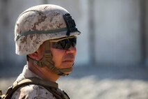 Brigadier Gen. Daniel Yoo, the deputy commanding general of 1st Marine Division, observes a military operation on urban terrain exercise held by Company A, 1st Battalion, 7th Marine Regiment, as part of Integrated Training Exercise aboard Marine Corps Air Ground Combat Center Twentynine Palms, California, Aug. 11, 2015. The MOUT exercise was conducted as part of Integrated Training Exercise and allowed the Marines to practice many different capabilities in preparation for future deployments.