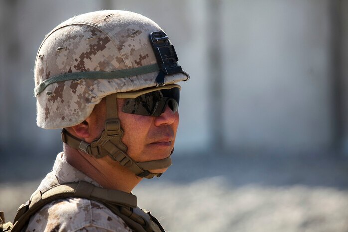 Brigadier Gen. Daniel Yoo, the deputy commanding general of 1st Marine Division, observes a military operation on urban terrain exercise held by Company A, 1st Battalion, 7th Marine Regiment, as part of Integrated Training Exercise aboard Marine Corps Air Ground Combat Center Twentynine Palms, California, Aug. 11, 2015. The MOUT exercise was conducted as part of Integrated Training Exercise and allowed the Marines to practice many different capabilities in preparation for future deployments.