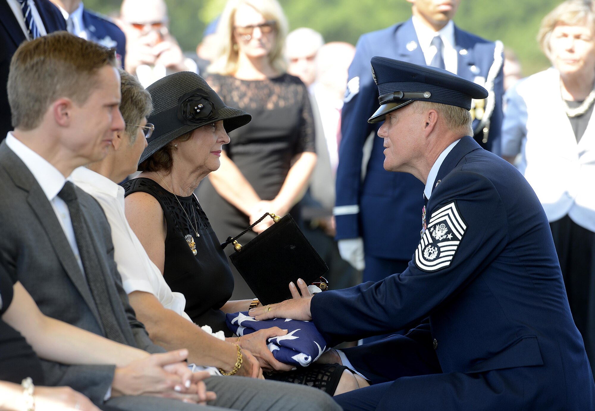 Chief Master Sgt. of the Air Force James A. Cody consoles Jan Binnicker, widow of ninth Chief Master Sgt. of the Air Force James Binnicker, before he is laid to rest in Arlington National Cemetery, Va., Aug. 14, 2015. Binnicker passed away March 21 in Calhoun, Ga. (U.S. Air Force photo/Scott M. Ash)