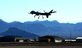 An MQ-9 Reaper performs touch-and-go flight patterns June 13, 2014, at Creech Air Force Base, Nev. The Reaper is an armed, multi-mission, medium-altitude, long-endurance remotely piloted aircraft that is employed primarily as an intelligence-collection asset and secondarily against dynamic execution targets. (U.S. Air Force photo/Senior Master Sgt. Cecilio Ricardo)