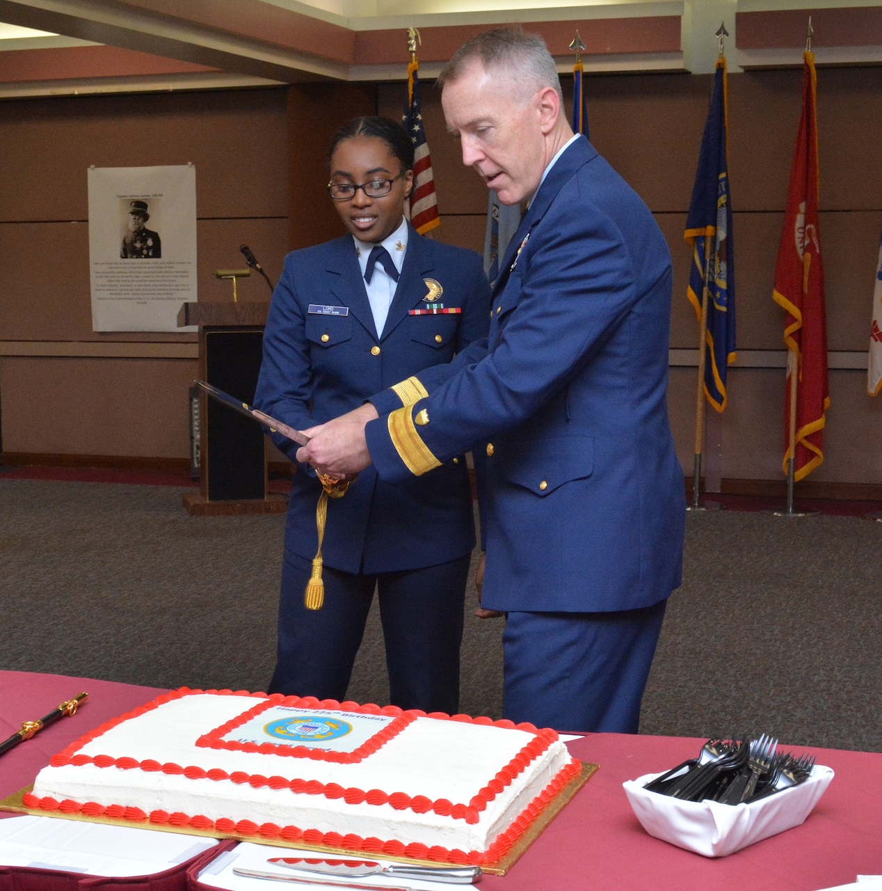 Coast Guard Rear Adm. Kevin E. Lunday and Coast Guard Petty Officer Kayla Lord, both members of U.S. Cyber Command, cut the cake in honor of the U.S. Coast Guard’s 225th birthday during a ceremony at Cybercom headquarters at Fort Meade, Md., Aug. 4, 2015. U.S. Cyber Command photo
