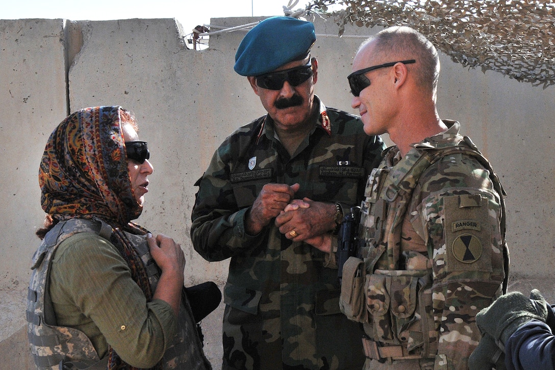 Afghan army Brig. Gen. Dawood Shah Wafadar, center, commander of the 205th Corps, 
greets U.S. Army Brig. Gen. Paul Bontrager, right, the commander of Train Advise Assist Command-South, at Kandahar Airfield, Afghanistan, Aug. 4, 2015, before an aerial battlefield familiarization flight of key terrain in southern Afghanistan to gain situational awareness and shared understanding of the area.