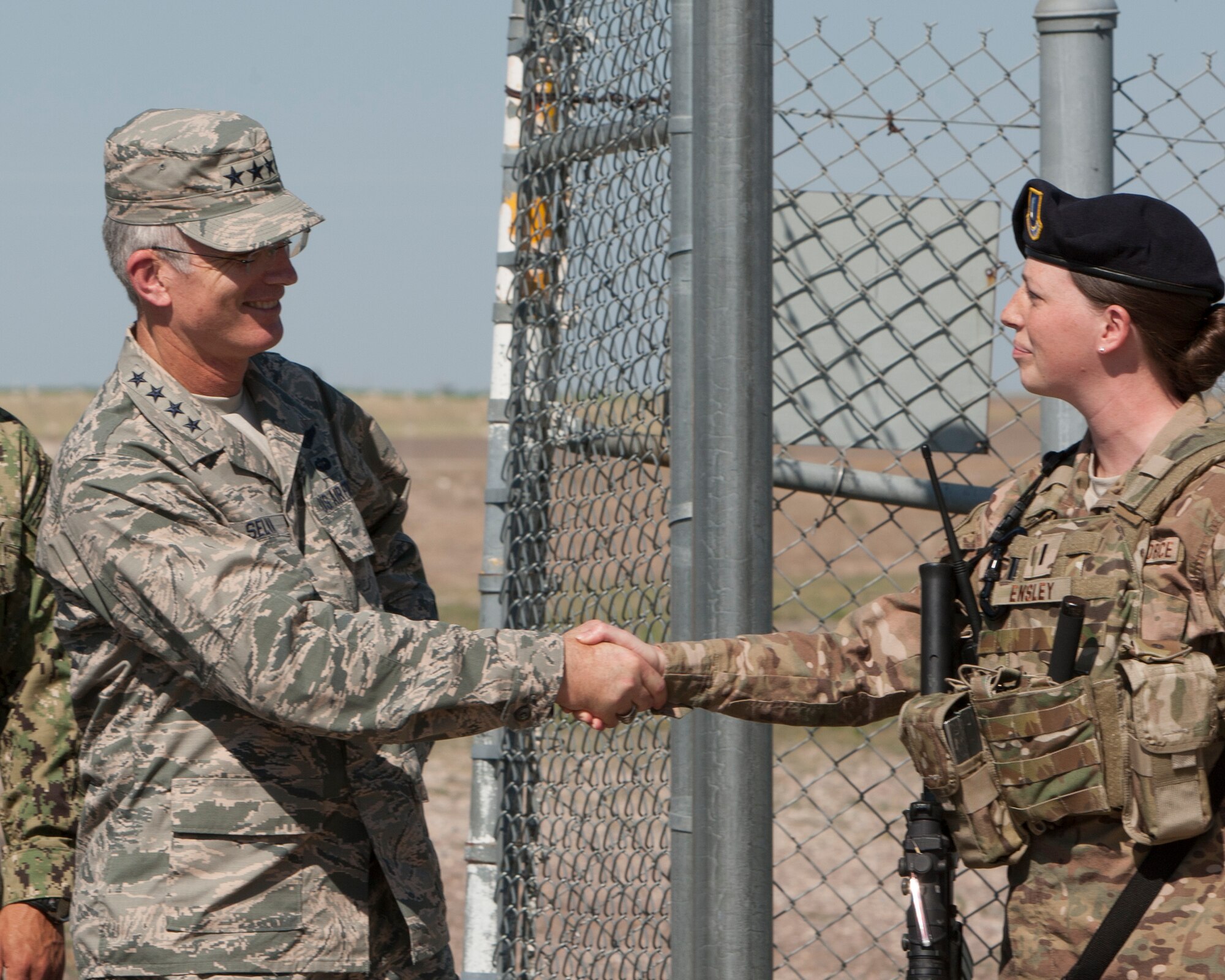 Gen. Paul J. Selva, vice chairman of the Joint Chiefs of Staff, greets 1st Lt. Helen Easley, 90th Missile Security Forces Squadron, at the front gate of a missile alert facility in Nebraska, Aug. 14, 2015. Selva was visiting the nuclear triad and learning about the ICBM leg of the triad at F.E. Warren Air Force Base. (U.S. Air Force photo by Lan Kim)