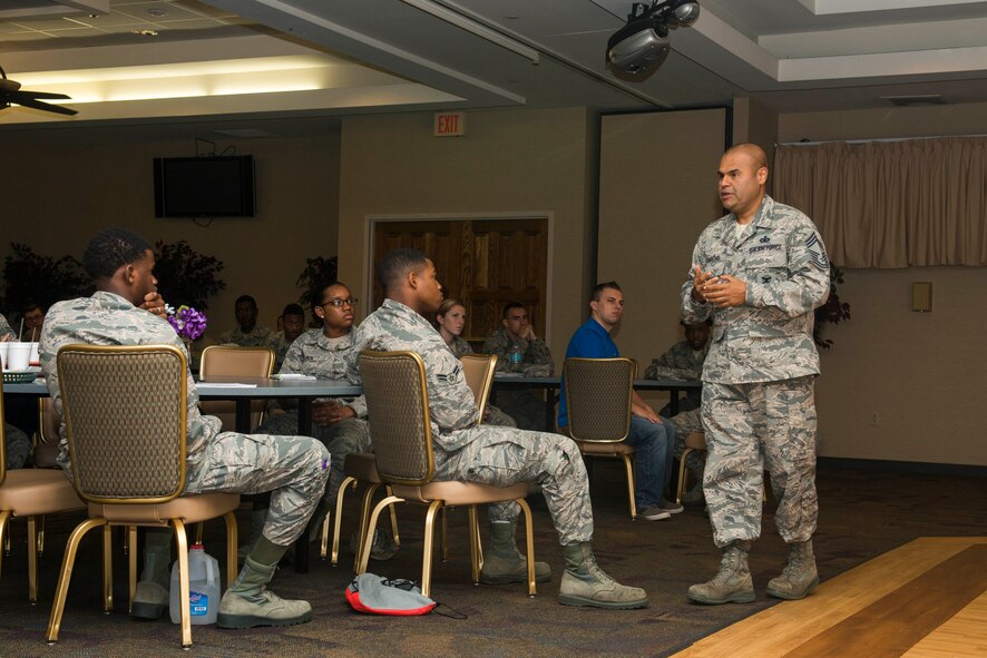 U.S Air Force Chief Master Sgt. Manuel Camacho, 23d Mission Support Group, speaks to Airmen during an Airmen Committed to Excellence general membership meeting Aug. 14, 2015, at Moody Air Force Base, Ga. Camacho encouraged Airmen to seek volunteer opportunities and continue improving their professional development. Camacho also thanked ACE for being instrumental in solving the base dormitories’ internet issues. (U.S. Air Force photo by Airman 1st Class Dillian Bamman/Released)