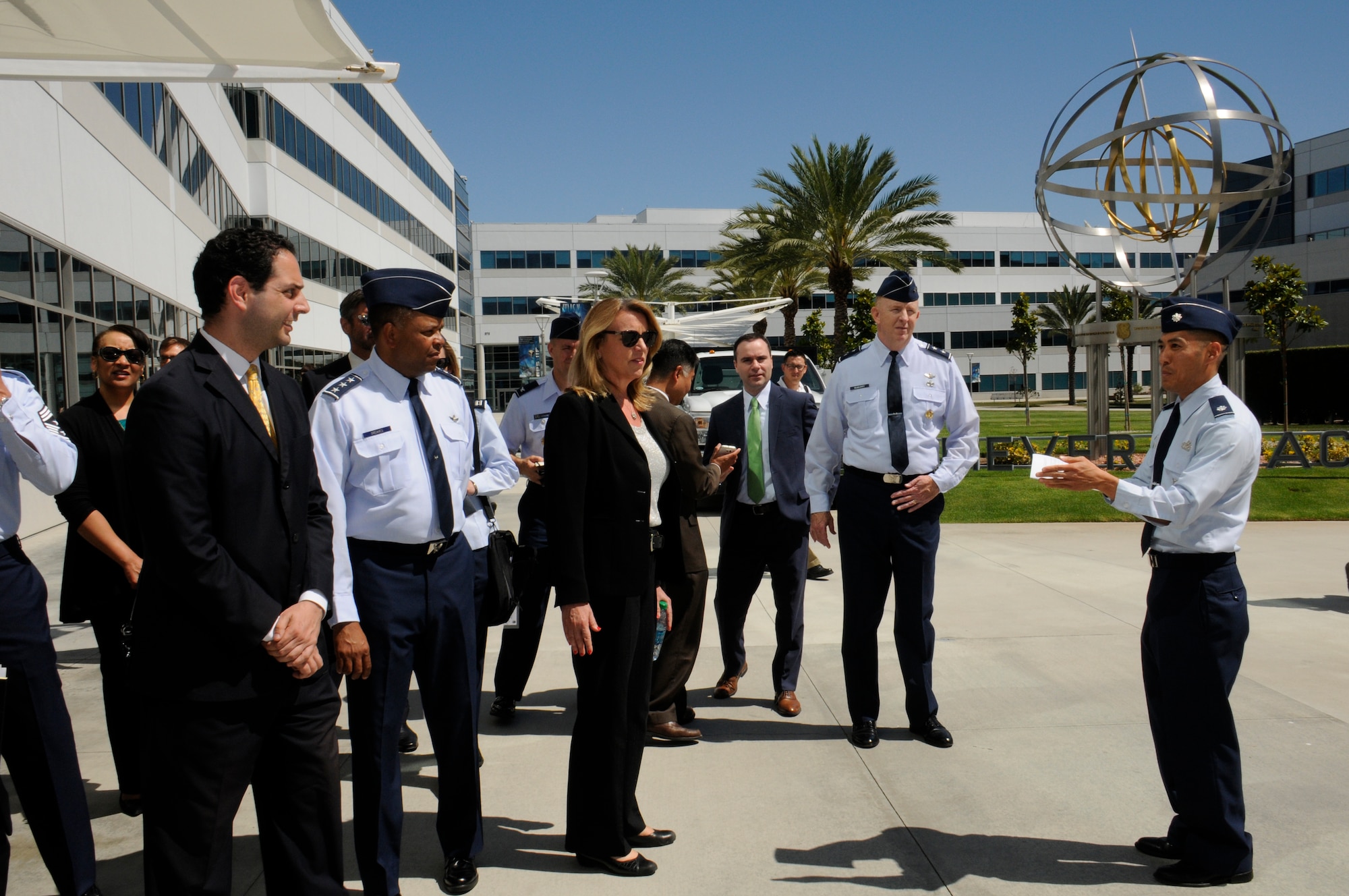 The Honorable Deborah Lee James, Secretary of the Air Force, Lt. Gen. Samuel Greaves, Space and Missile Systems Center commander and Air Force Program Executive Officer for space, Dr. Camron Gorguinpour, Secretary of the Air Force for Acquisition’s Office of Transformational Innovation and Maj. Gen. Robert McMurry, SMC vice commander are briefed by Lt. Col. Todd Inouye, 61st Civil Engineer and Logistics Squadron commander on the benefits of the latest generation of plug-in electric vehicles during Secretary James’ visit to Los Angeles Air Force Base in El Segundo, Calif. Aug. 12. (U.S. Air Force photo/Joseph Juarez)
