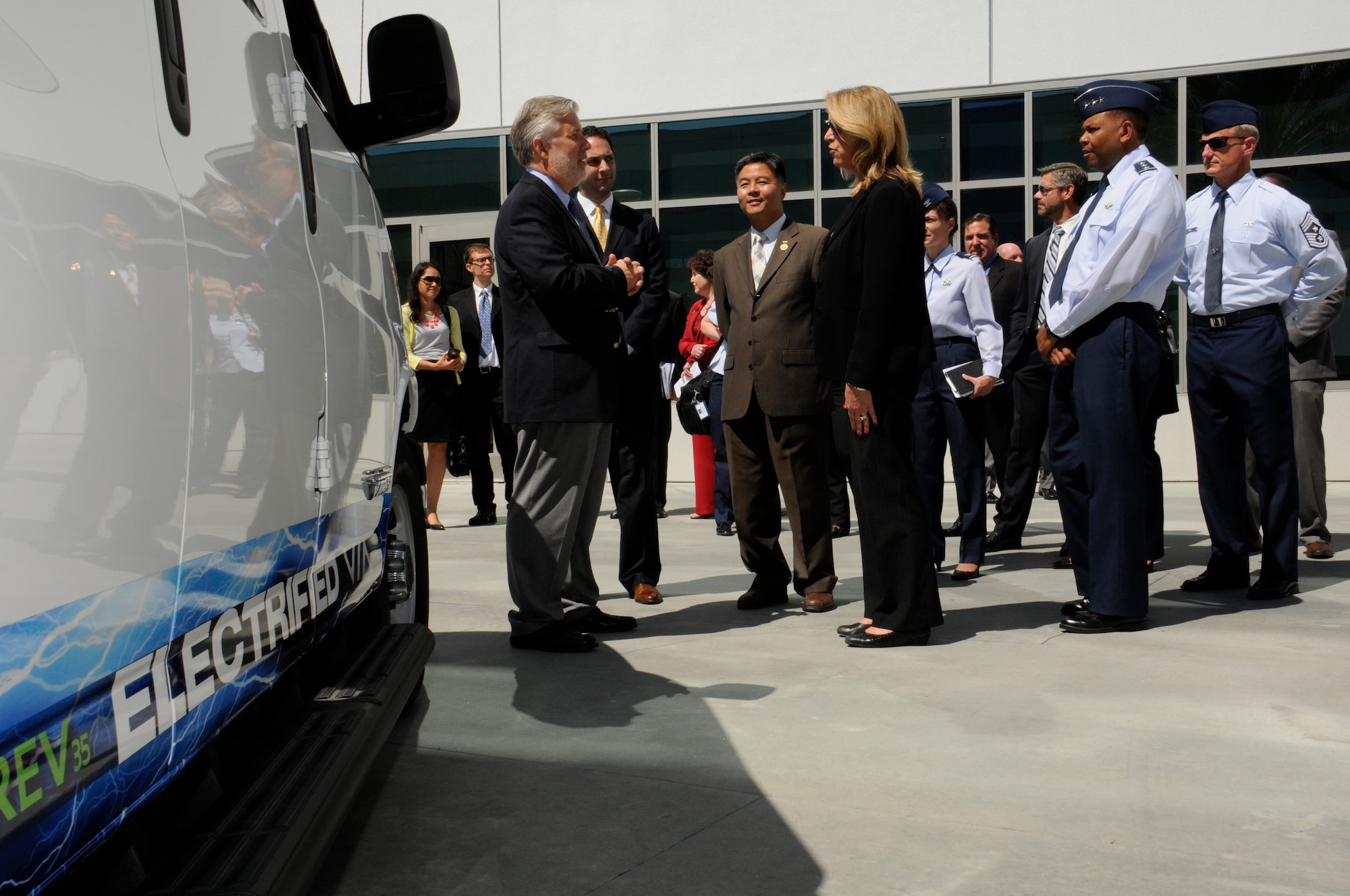 The Honorable Deborah Lee James, Secretary of the Air Force, U.S. Representative Ted Lieu, California 33rd congressional district and Dr. Camron Gorguinpour, Secretary of the Air Force for Acquisition’s Office of Transformational Innovation are briefed on the benefits of the latest generation of plug-in electric vehicles by Michael Gravely, Research and Development division chief of the California Energy Commission as Lt. Gen. Samuel Greaves, Space and Missile Systems Center commander and Air Force Program Executive Officer for space, Col. Donna Turner, 61st Air Base Group commander and Chief Master Sgt. Craig Hall, SMC command chief listen in. (U.S. Air Force photo/Joseph Juarez)
