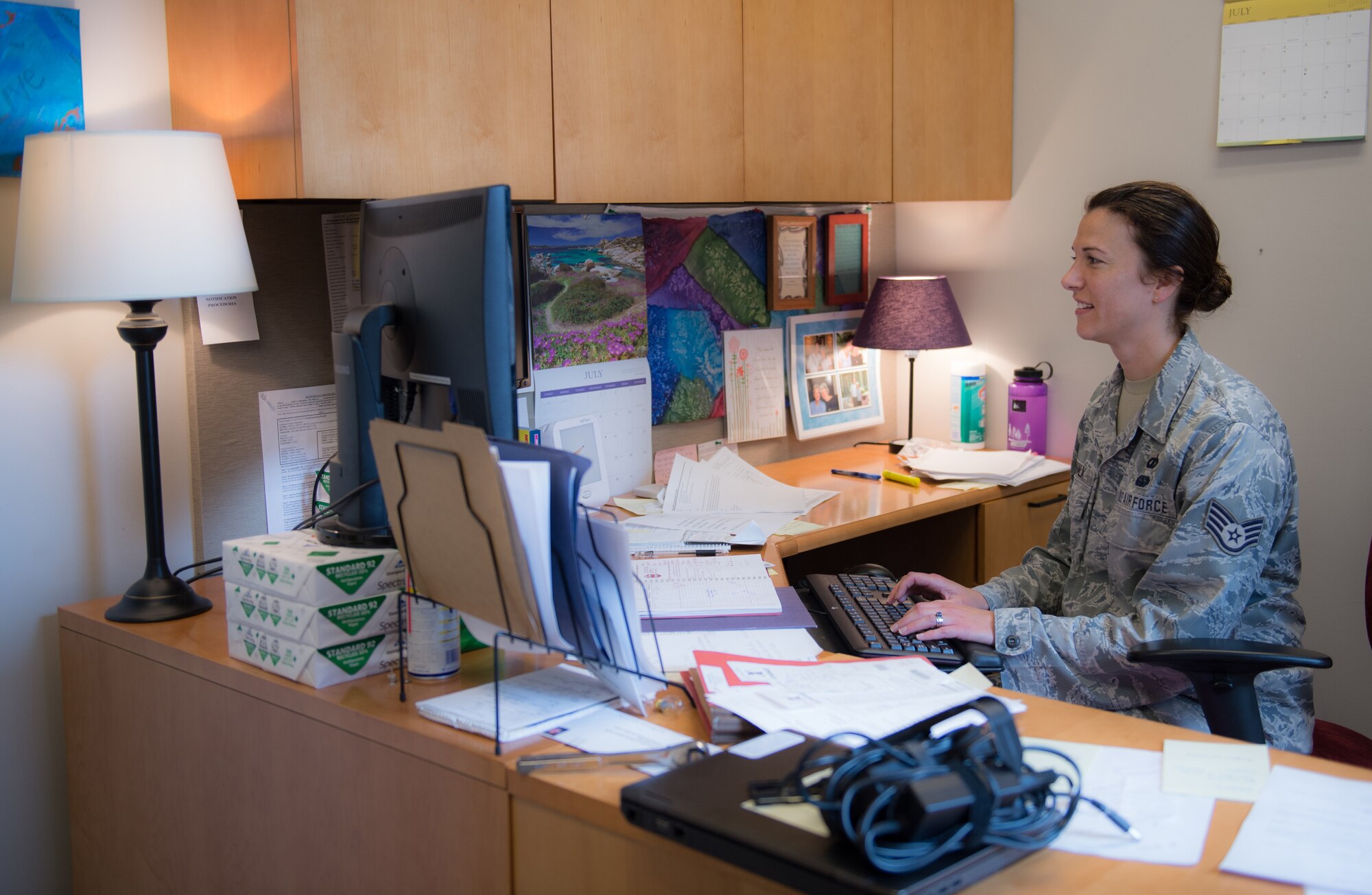 U.S. Air Force Staff Sgt. Jen Vahalik, the 354th Fighter Wing NCO in-charge of chapel plans and programs, responds to Airmen about an upcoming white water rafting trip, July 29, 2015, in the Base Chapel at Eielson Air Force Base, Alaska. Vahalik coordinated multiple retreats hosted by the chapel, which helped raise morale for Airmen and their families. (U.S. Air Force photo by Staff Sgt. Shawn Nickel/Released)