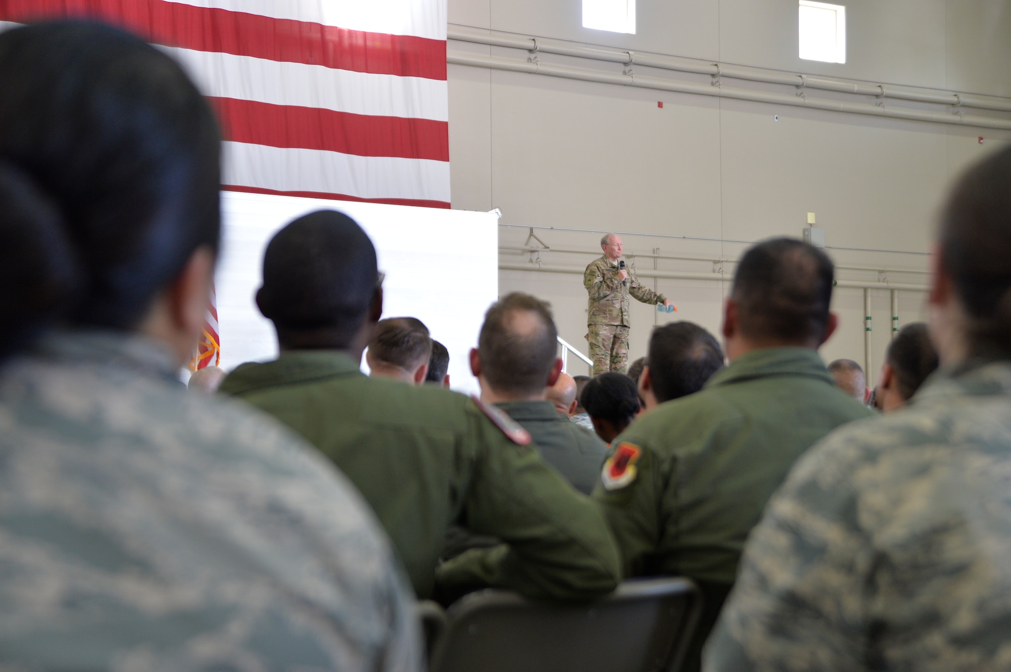 Army Gen. Martin E. Dempsey, Chairman of the Joint Chiefs of Staff speaks during an all-call on Aug. 12, 2015, at Creech Air Force Base, Nevada. During his visit to Creech AFB, Dempsey and his wife Deanie toured the base to ask the Creech Airmen questions. (U.S. Air Force photo by Airman 1st Class Christian Clausen/Released)