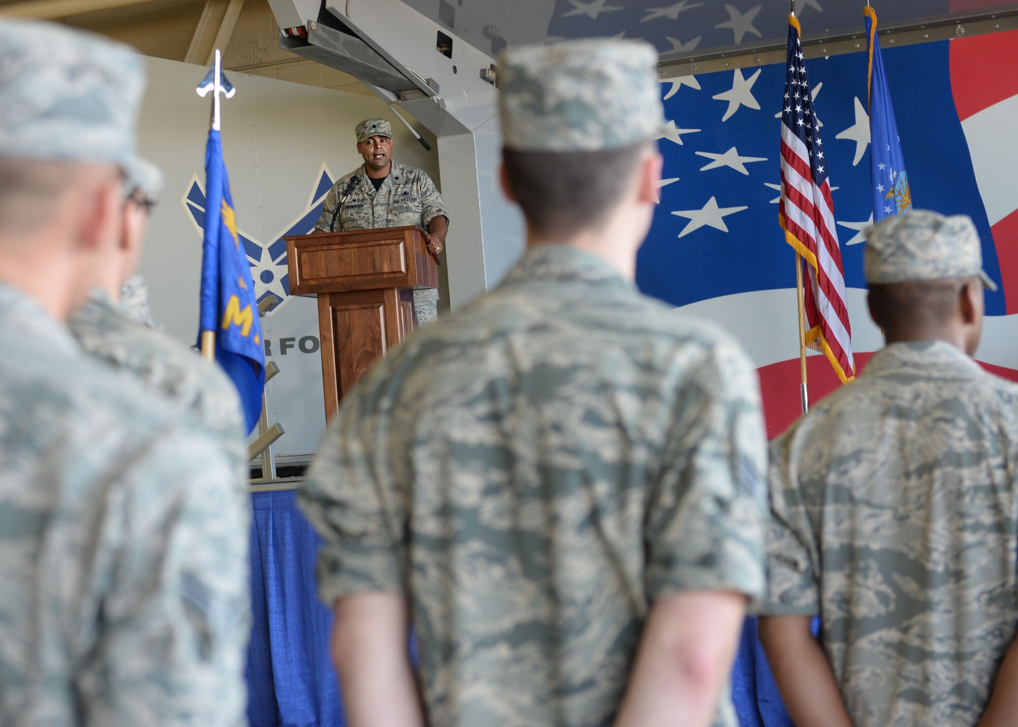 Lt. Col. Edwin Germosen, incoming 4th Aircraft Maintenance Squadron commander, speaks to his squadron for the first time as its new commander during a change of command ceremony Aug. 14, 2015, at Seymour Johnson Air Force Base, North Carolina. As new commander, he is now responsible for more than $700 million in facilities and support equipment. (U.S. Air Force photo/Airman 1st Class Ashley Williamson)