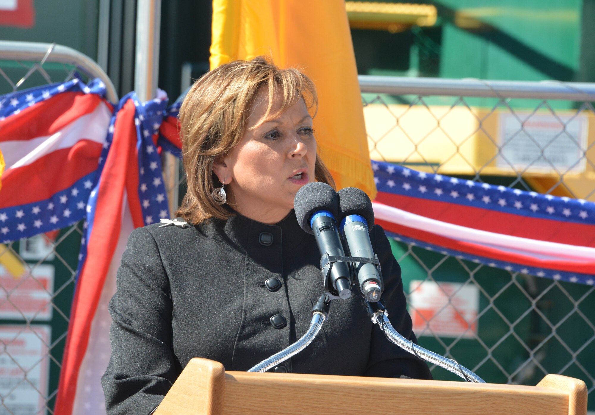 New Mexico Governor Susana Martinez speaks to guests and media at Kirtland's bulk fuels facility milestone event Aug. 13. The event marked the installation of a pump-and-treat water system and the successful extraction and treatment of fuel contamination associated with a fuel leak discovered in 1999. The system has treated more than two million gallons of water. (Photo by Dennis Carlson)