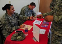 Staff Sgt. Nataly Hatfield, 319th Logistics Readiness Squadron flight service center NCO-in-charge, receives a payment for Air Force Ball tickets August 14, 2015, at the Exchange on Grand Forks Air Force Base, North Dakota. Tickets for the ball will be on sale Monday, Wednesday and Friday from 11 a.m. to 1 p.m. through September 4, 2015 at the Exchange. (U.S. Air Force photo by Airman 1st Class Ryan Sparks/Released)