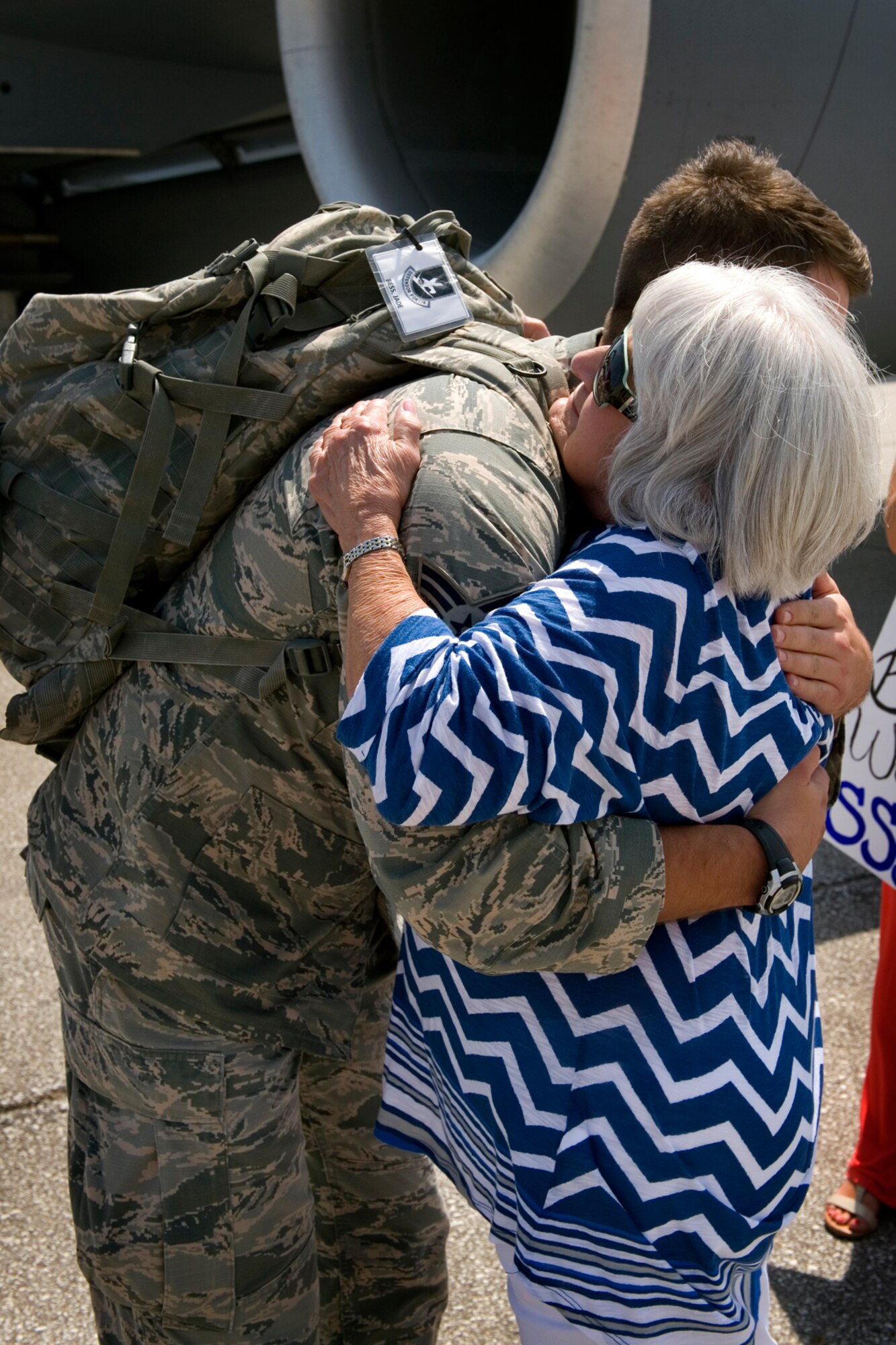 Senior Airman Jade Bess, 434th Security Forces Squadron fire team member, embraces his grandmother, Patty Faucett, at Grissom Air Reserve Base, Ind., August 8, 2015.  The defenders were the last group from their unit to return home following a deployment of approximately 60 434th SFS Airmen supporting Operation Inherent Resolve. (U.S. Air Force photo/Tech. Sgt. Benjamin Mota)