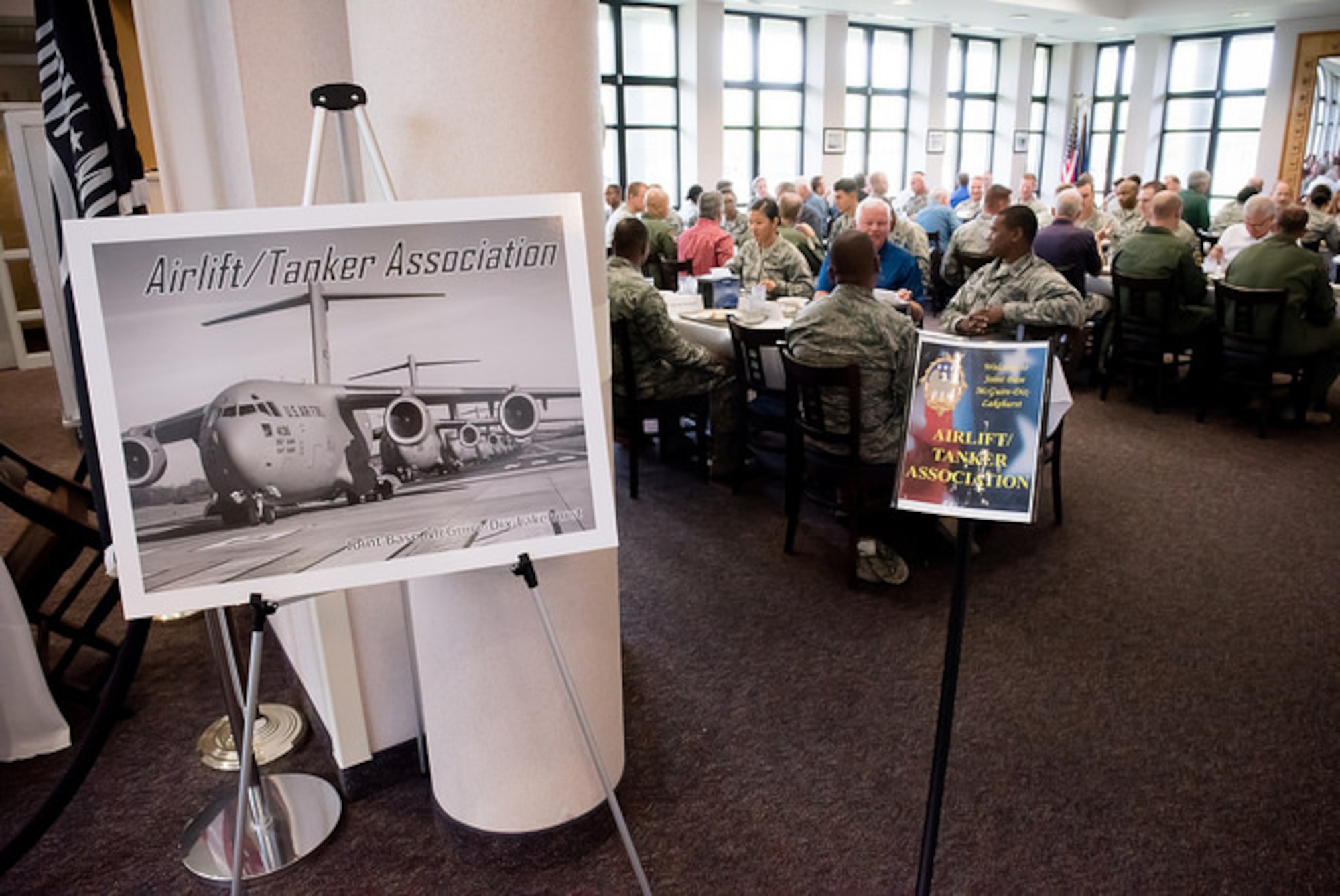 Visiting members of the Airlift/ Tanker Association speak with Airmen at the Halverson Hall dining facility Aug. 11, 2015, at Joint Base McGuire-Dix-Lakehurst, N.J. The luncheon gave them the opportunity to mentor and share experiences with Airmen. (U.S. Air Force photo by Russ Meseroll/Released)