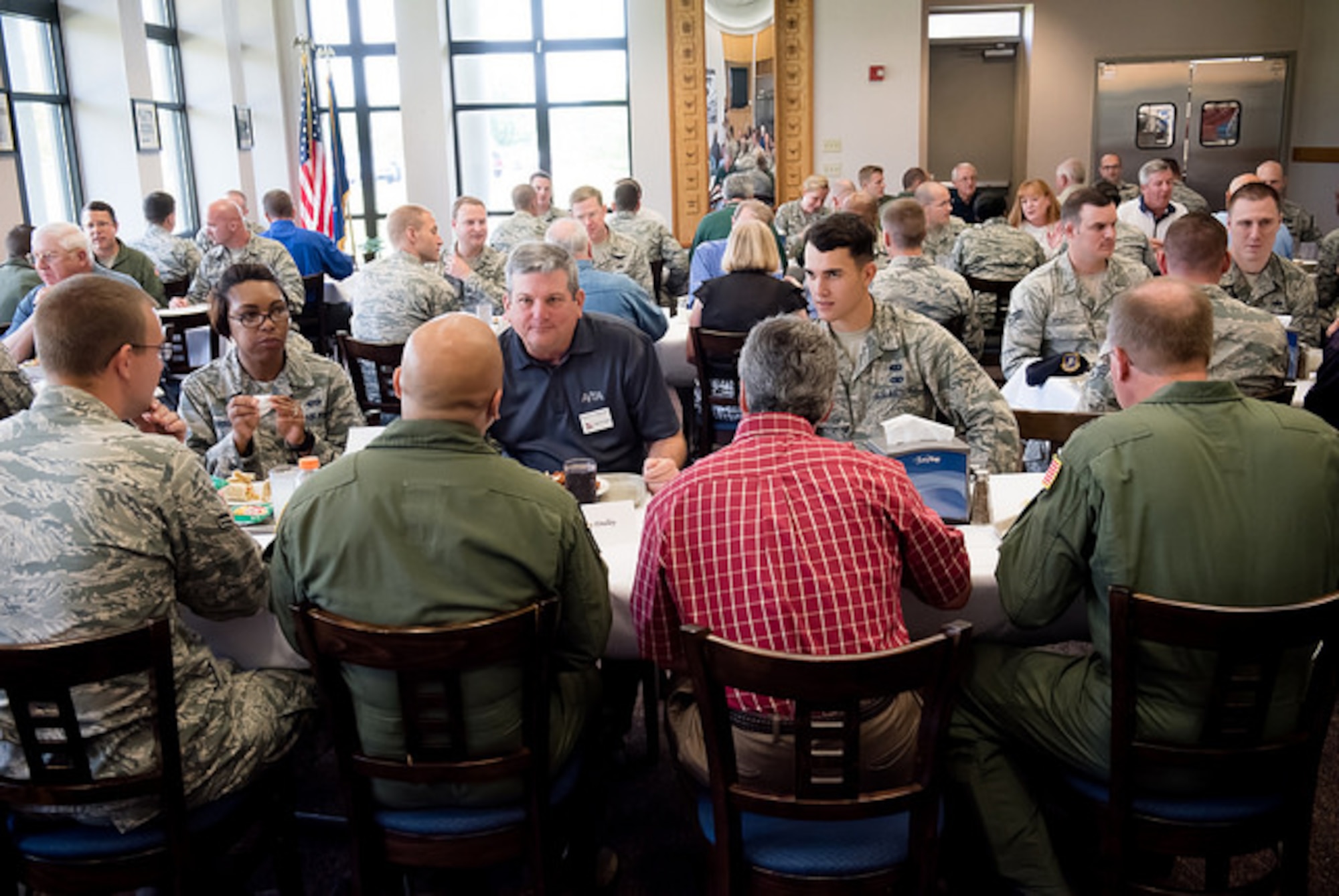 Visiting members of the Airlift/ Tanker Association speak with Airmen at the Halverson Hall dining facility Aug. 11, 2015, at Joint Base McGuire-Dix-Lakehurst, N.J. The luncheon gave them the opportunity to mentor and share experiences with Airmen. (U.S. Air Force photo by Russ Meseroll/Released)