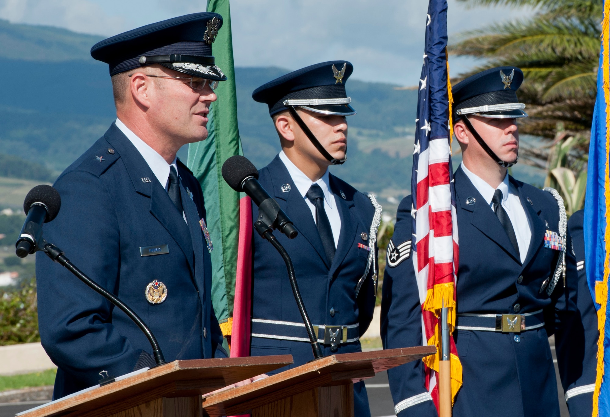 Brig. Gen. Jon Thomas, commander of the 86th Airlift Wing, Ramstein Air Base, Germany, speaks to members of the new 65th Air Base Group and Portuguese community during a Redesignation Ceremony at Lajes Field, Azores, Portugal, August 14, 2015. With this Redesignation Ceremony, the 65th Air Base Group is now aligned under the 86th Airlift Wing and remains positioned to provide agile combat support and services to aircraft and aircrews. (U.S. Air Force photo by Master Sgt. Bradley C. Church)