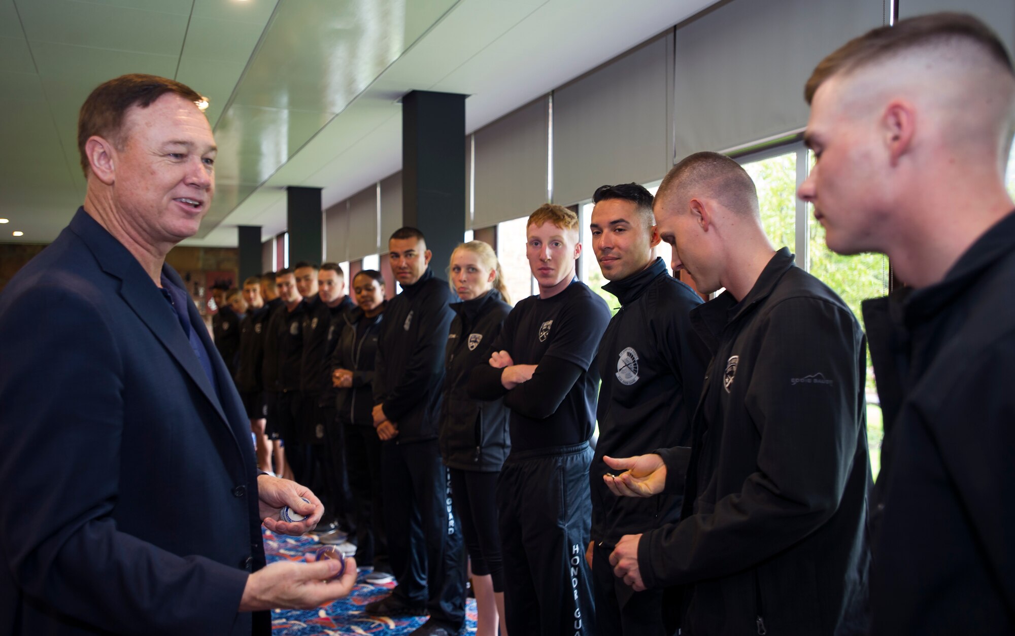 Maj. Gen. Darryl Burke, Air Force District of Washington commander, speaks with members of the United States Air Force Honor Guard Drill Team in Edinburgh, Scotland, Aug. 14, 2015. The honor guard was recognized for their participation in The Royal Edinburgh Military Tattoo. 20 members of the U.S. Honor Guard Drill team traveled to the United Kingdom to represent the USAF and the Department of Defense as the only branch of military service from the U.S. performing in the tattoo. The 66th production of the tattoo welcomed more than 220,000 spectators from around the world for a span of more than three weeks. (U.S. Air Force photo/Staff Sgt. Nichelle Anderson/released)
