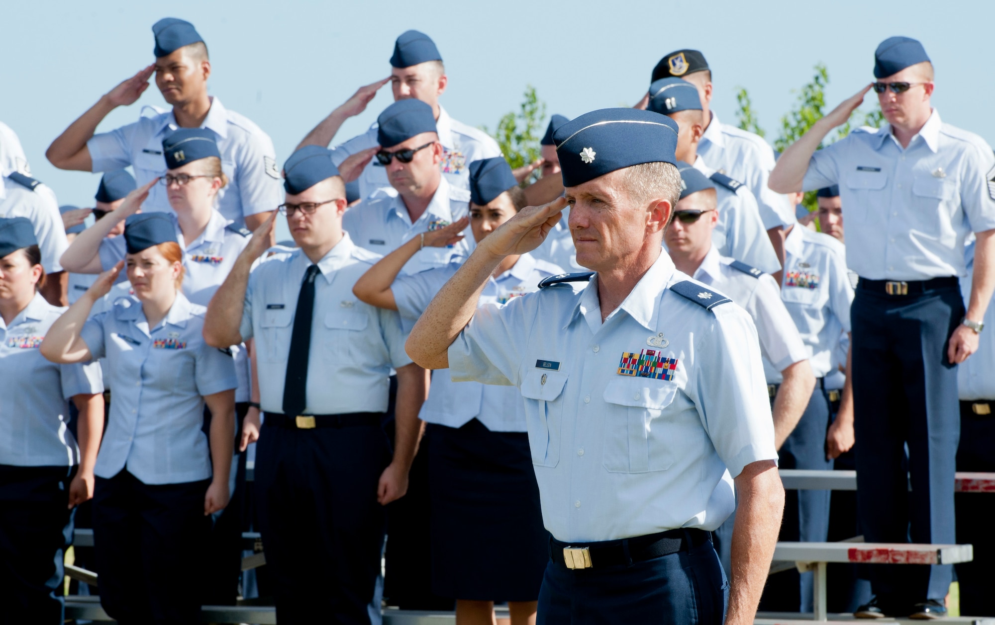 Lt. Col. Brian Belson, deputy commander of the 65th Air Base Group, salutes during the 65th Air Base Wing’s Redesignation Ceremony on Lajes Field, Azores, Portugal, August 14, 2015. With this Redesignation Ceremony the 65th Air Base Group is now aligned under the 86th Airlift Wing and remains positioned to provide agile combat support and services to aircraft and aircrews. (U.S. Air Force photo by Master Sgt. Bradley C. Church) 