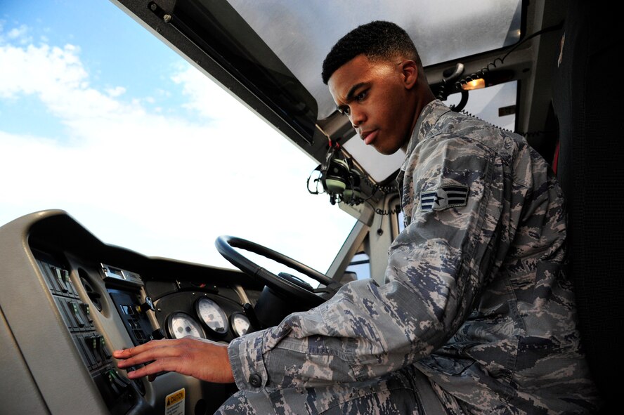 Senior Airman Shaquille Montague, 56th CES Fire Services driver operator, conducts a morning safety check in the P-19 Stryker fire truck. Safety checks are conducted daily to ensure the headlights, windshield wipers, emergency lights and more, are operational.