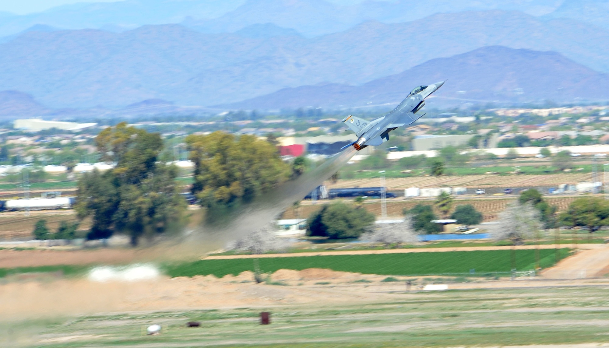 An F-16 Fighting Falcon does a near-vertical takeoff at Luke Air Force Base. More than 25 nations across the globe use the F-16 in their defense in a collaborative effort with the United States to ensure all countries can defend themselves against any enemy. (U.S. Air Force photo by Senior Airman Marcy Copeland)