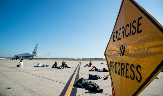 Joint Base Andrews, Md., conducted an emergency-readiness exercise on the flight line, here, Aug. 15, 2015. JBA is holding an air show Sept. 19, and the exercise is the installation’s way of evaluating effectiveness, communication, safety and efficiency. (U.S Air Force photo/Airman 1st Class Philip Bryant)