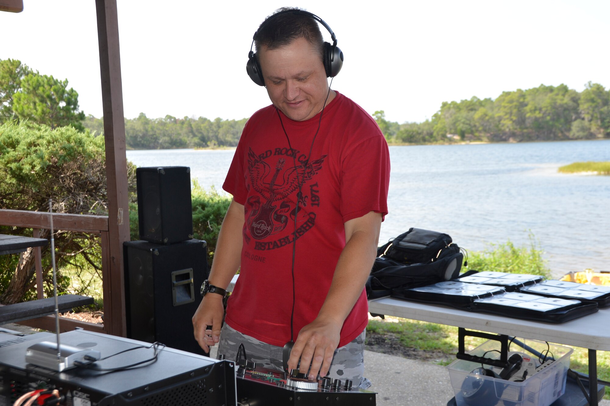 Master Sgt. John Fuschich, National Security and Emergency Preparedness directorate, offered up the disc-jockey jams for the 1st Air Force (Air Forces Northern) “Family Day 2015” Aug. 7 at Bonita Bay. The day focused on taking care of the organization’s families and featured a variety of activities that included food and sport competitions, a waterslide and plenty to eat and drink. (Air Force Photo Released/Mary McHale)