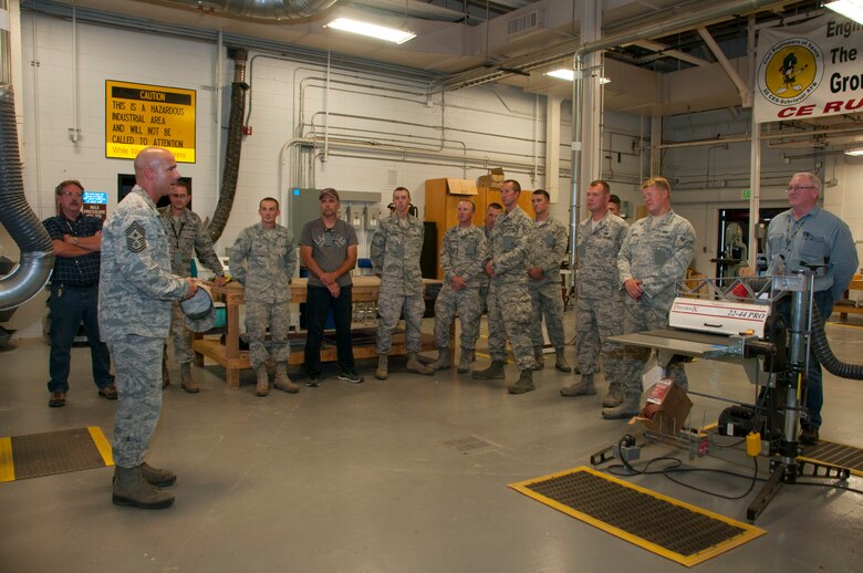 Chief Master Sgt. John Bentivegna, 50th Space Wing command chief, speaks to members of the 50th Civil Engineer Squadron during a unit visit Wednesday, August 12, 2015, at Schriever Air Force Base, Colorado. Col. Stephen Slade, Individual Mobilized Augmentee to the 50 SW commander, and  Bentivegna wanted to personally thank the members of the 50 CES for their hard work for stepping up  to support the Joint Interagency Coalition Space Operations Center construction efforts. (U.S. Air Force photo/Senior Airman Naomi Griego)