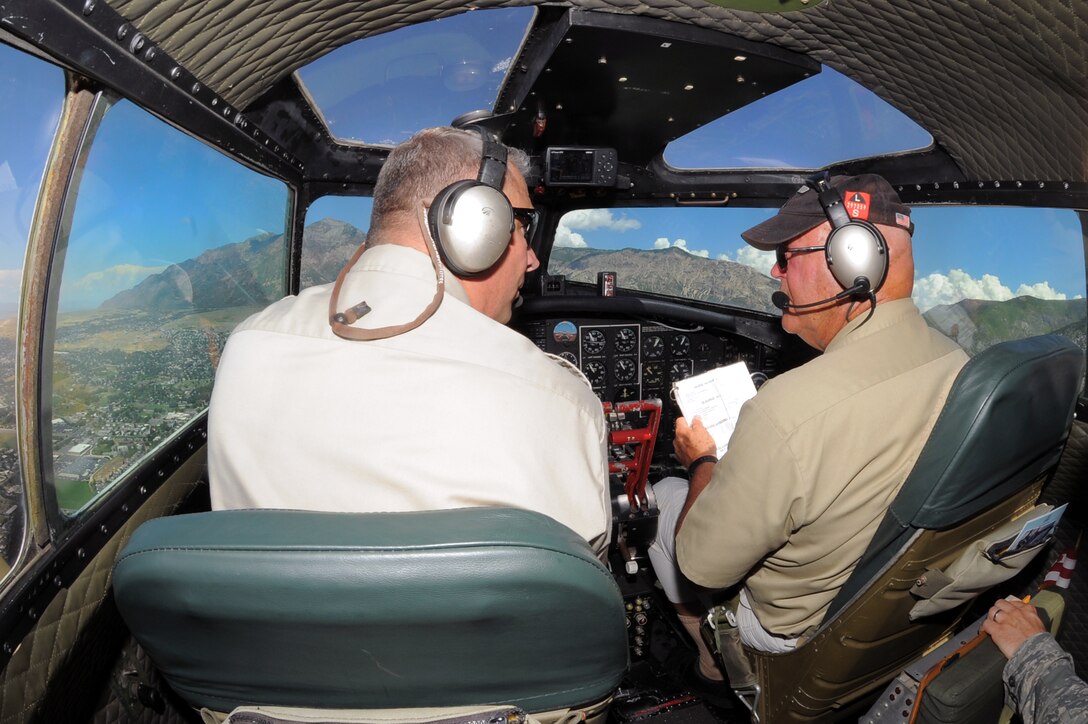 John Bode, left, and Shawn Knickerbocker fly Experimental Aircraft Association’s B-17, "Aluminum Overcast," through the air above northern Utah, Aug. 13, 2015.  Aluminum Overcast is flown at locations around the United States in honor of military men and women. (U.S. Air Force Photo by Todd Cromar/Released)