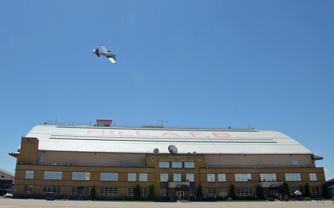 Experimental Aircraft Association’s B-17 “Aluminum Overcast” passes over Hangar 1, one of the oldest permanent buildings on Hill Air Force Base, Utah, Thursday, Aug. 13, 2015. In 1939, the base was given the name "Hill Field" in honor of Army Air Corps Maj. Ployer P. Hill, who died in a crash while testing a Boeing Model 299 aircraft that would ultimately become the B-17 Flying Fortress Bomber. (U.S. Air Force photo/Alex R. Lloyd)