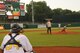 Military Youth Kamryn Phillips throws the first pitch to kick start the Montgomery Biscuits baseball game at the Montgomery Riverwalk Stadium July 30, 2015, in Montgomery, Alabama. After throwing the pitch, the catcher revealed himself to be Kamryn’s father, Tech. Sgt. Gabriel Phillips, Air Force Officer Training School, 22nd Training Squadron physical conditioning instructor, home from deployment. (U.S. Air Force photo by Airman 1st Class Alexa Culbert)