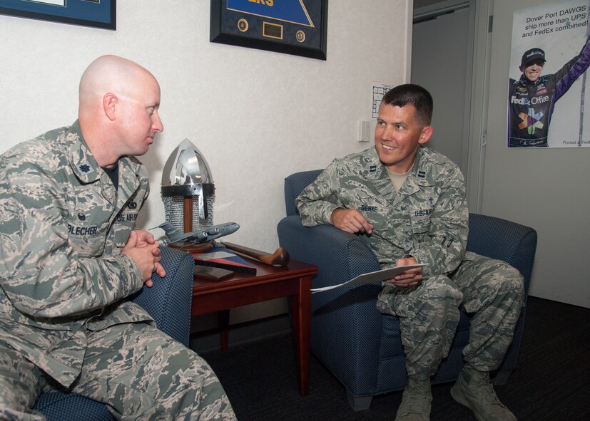 Chaplain (Capt.) Quentin Genke, 436th Airlift Wing chaplain, distributes snacks to Airmen, August 7, 2015, near the flightline on Dover Air Force Base, Del. Chaplains often take trips around squadrons on base to ensure Airmen understand what chaplains do and how they can assist Airmen. (U.S. Air Force photo/Senior Airman Jared Duhon) 