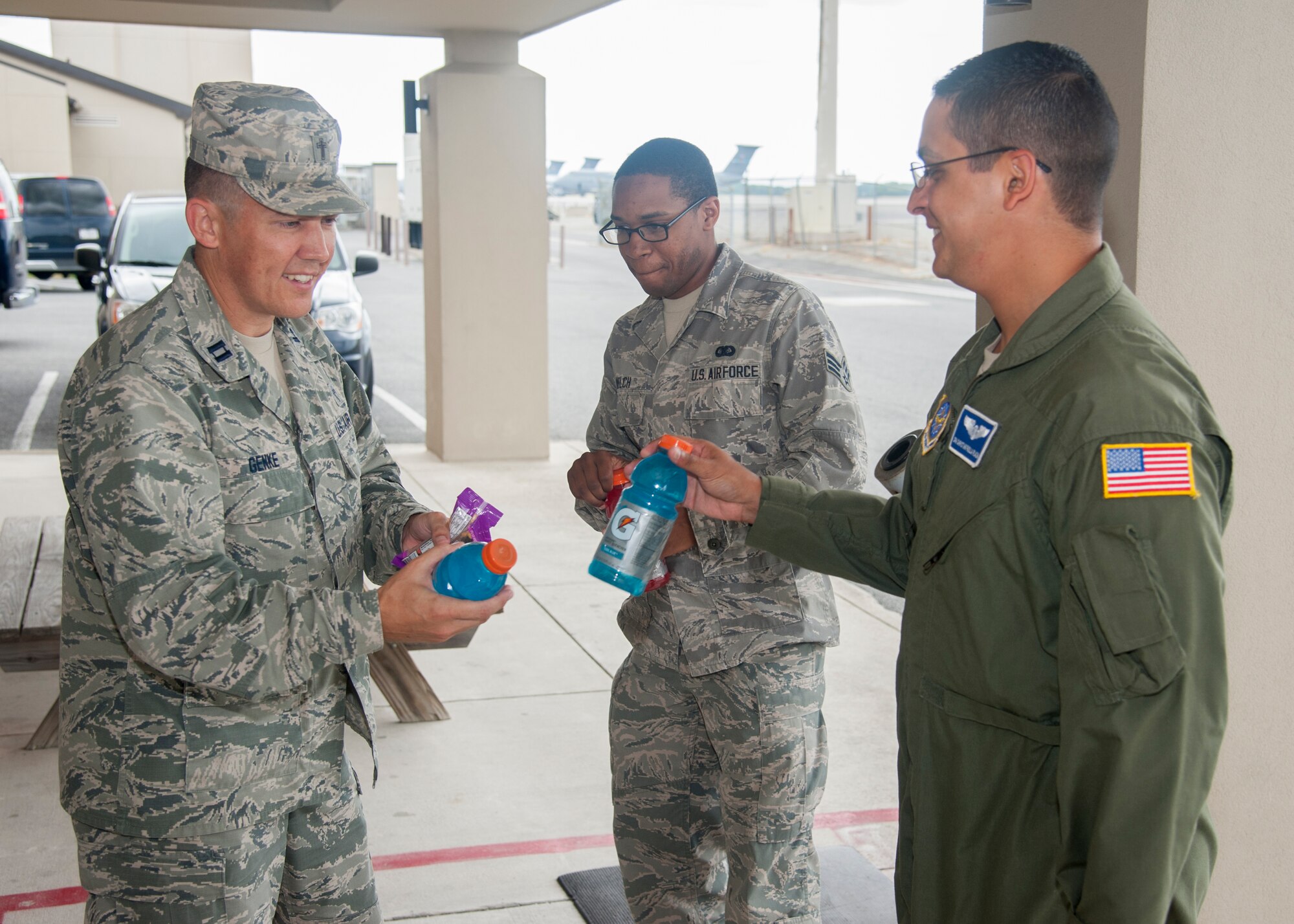 Lt Col. Jarod Blecher, 436th Aerial Port Squadron commander, talks with Chaplain (Capt.) Quentin Genke, 436th Airlift Wing chaplain, August 7, 2015, at the Aerial Port on Dover Air Force Base, Del. Chaplains advise commanders and leadership on religious accommodations, as well as inform them of upcoming religious holidays. (U.S. Air Force photo/Senior Airman Jared Duhon) 