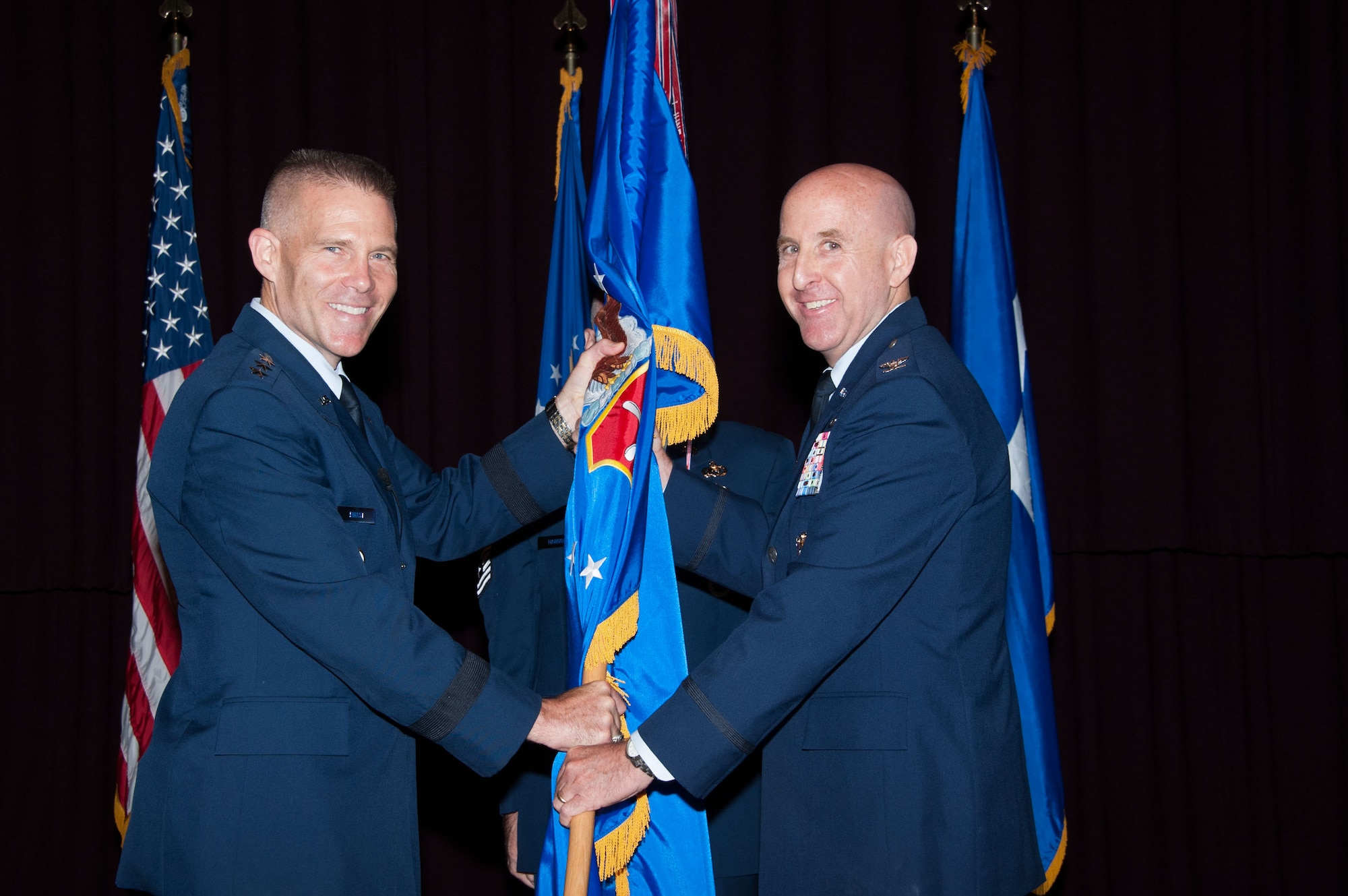 Col. Edward Thomas Jr. assumes command of the Thomas N. Barnes Center for Enlisted Education from Lt. Gen. Steven Kwast, Air University commander and president, at Maxwell Air Force Base, Aug. 3. Thomas previously served as the U.S. European Command director of Public Affairs. He was responsible for integrating the command’s communication efforts with its component commands, partner nations, and U.S. embassies in 51 countries within its area of focus. (U.S. Air Force photo by Bud Hancock) 